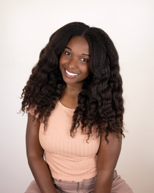 Black women smiling with long natural hair