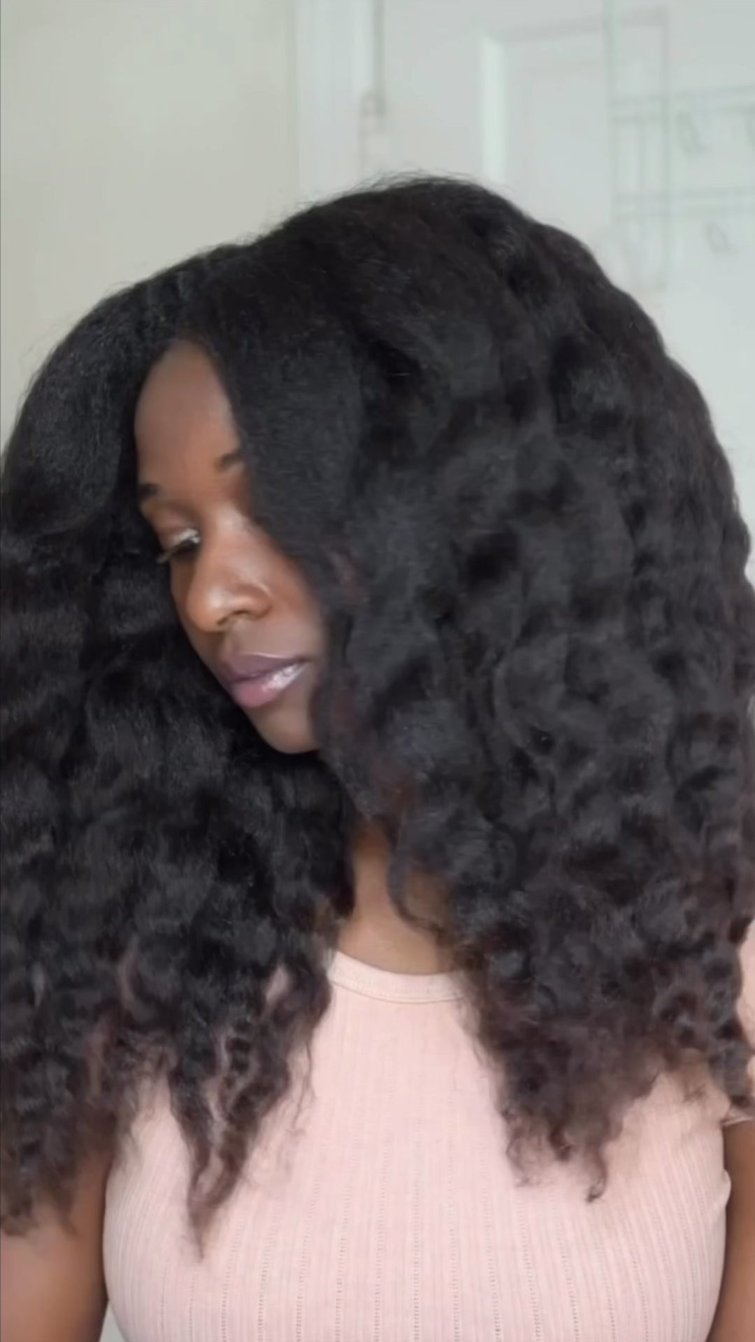 Black woman with natural 4b 4c hair using My Journey Haven Growth Oil and Crown healthy hair balm to style hair in twist and braids